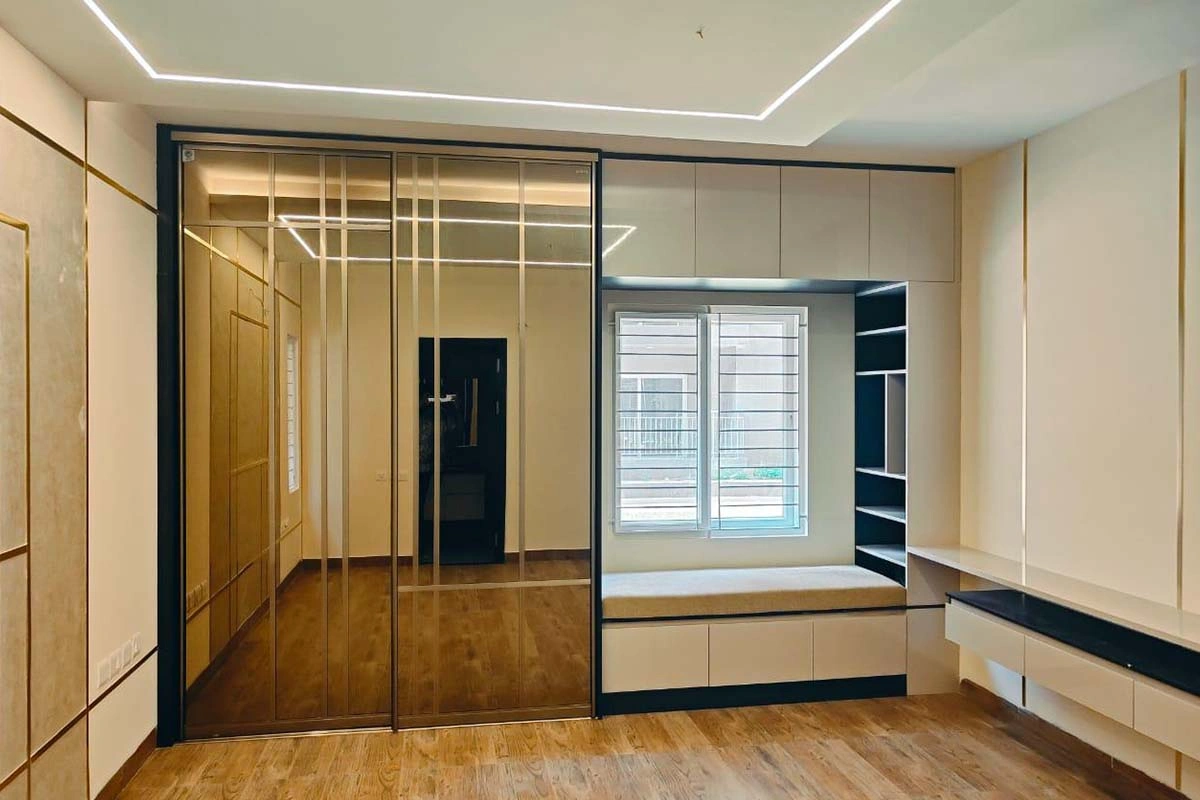 Modern apartment living room in Chennai showcasing elegant color schemes, furniture design, and contemporary interior styling.